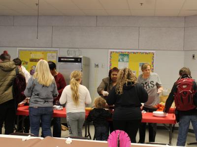 Parents and students work their way through the lunch line