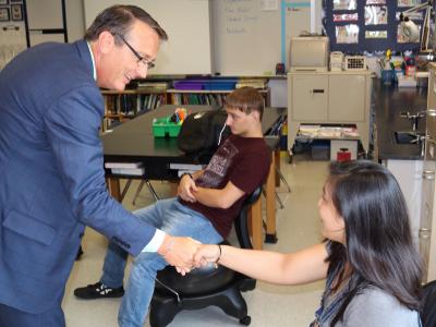 photo of Superintendent Brabrand greeting students
